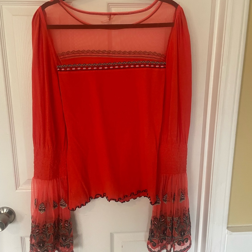 Stylish orange shirt with bell bottom sleeves